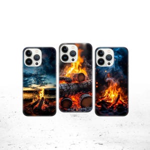 May include: Three phone cases with bonfire designs. The first case shows a bonfire at dusk with a dark blue sky. The second case features a close-up of burning logs. The third case displays a bonfire with blue smoke.