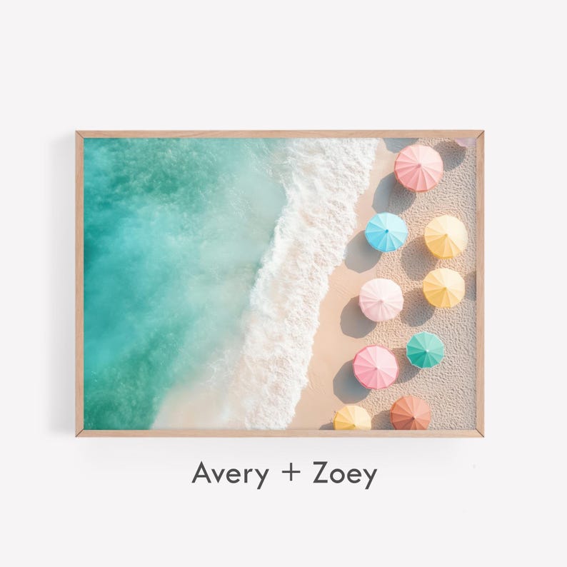 May include: An aerial view of a beach with turquoise water and white sand. A row of colorful umbrellas line the beach, creating a vibrant and cheerful scene.
