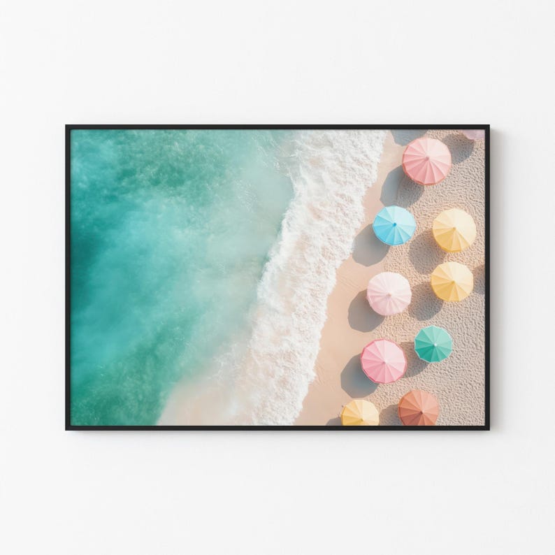 May include: An aerial view of a sandy beach with turquoise water and a row of colorful beach umbrellas. The umbrellas are pink, yellow, blue, and green.