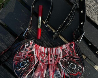 black and red painted bag with butterfy