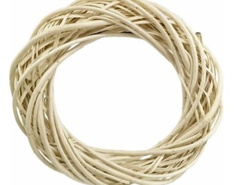 May include: A white wicker wreath, perfect for crafting and decorating.