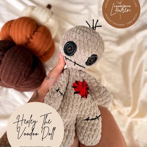 May include: A light grey crochet voodoo doll with black button eyes and a stitched mouth. The doll features a red heart on its chest and black stitched details. The text "Hexey The Voodoo Doll" and "CROCHET PATTERN PDF" are visible.
