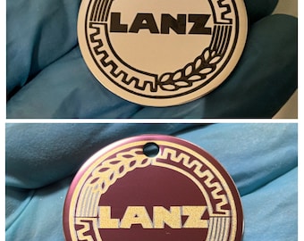 Portachiavi rotondo in acciaio inossidabile lucidato a specchio di Heinrich Lanz AG Bulldog. Possibilità di personalizzazione.