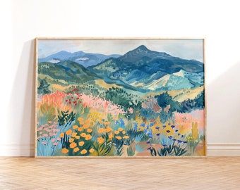 May include: A framed painting depicting a landscape with a mountain range in the background and a field of colourful flowers in the foreground. The mountains are painted in shades of blue and green, while the flowers are painted in shades of yellow, pink and orange.
