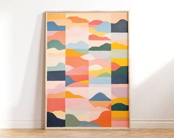 May include: Abstract art print featuring a geometric pattern of colorful shapes, including orange, yellow, green, blue, and pink. The print is framed in a light wood frame.