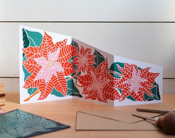 Festive Poinsettia Greeting Card | Single Garland Card & Envelope, folding concertina card with bold xmas flowers in red and pink.