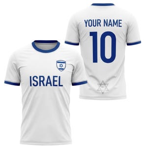 May include: White soccer jersey with blue accents. The front displays the word "ISRAEL" and a Star of David emblem. The back features the number "10" in blue and the text "YOUR NAME".