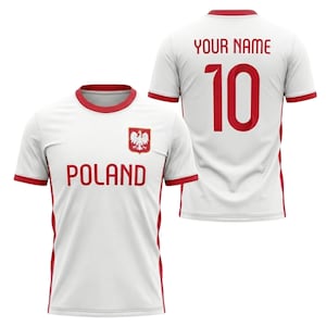 May include: White soccer jersey with red trim, featuring the word "POLAND" and a Polish coat of arms. The back displays the number 10 and the text "YOUR NAME" in red. The jersey is short-sleeved.