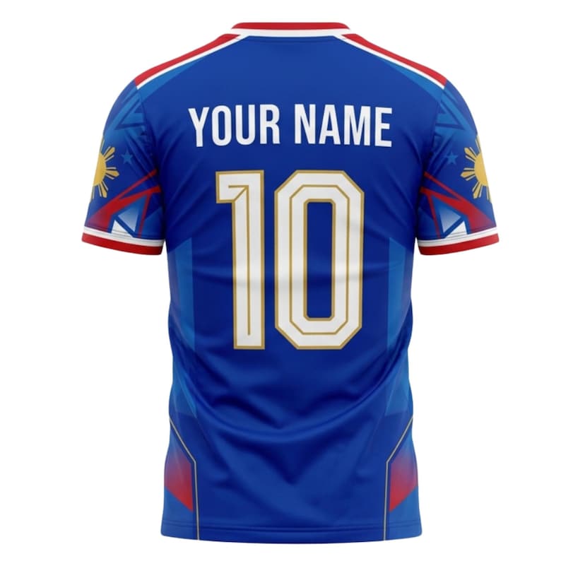May include: A blue soccer jersey with the text "YOUR NAME" above the number "10". The jersey has red and white trim on the collar and sleeves. The design includes a sun and star emblem on the sleeves.