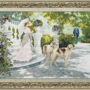 May include: Cross-stitch artwork depicting a woman in a pink dress and parasol on a white staircase, with two dogs and a man in the background. The scene is set in a garden with floral accents and a decorative gold frame.