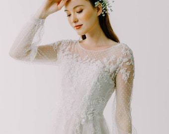 Lace long sleeve wedding dress in a-line form and open back