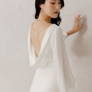 Elegant Silky Satin Wedding Dress with Long Sleeves and V-Neckline