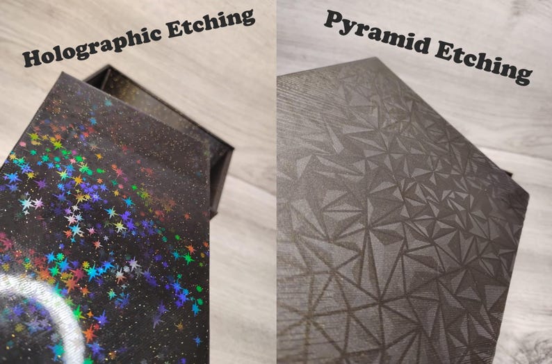 May include: Two boxes with different surface designs. One box has a black surface with holographic stars and the text "Holographic Etching". The other box has a gray pyramid pattern and the text "Pyramid Etching".