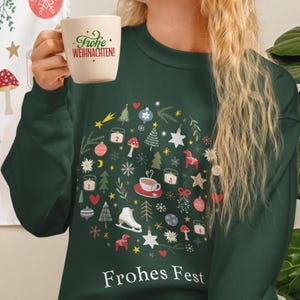 Sweat-shirt de Noël allemand : Frohes Fest, edelweiss, Avent, thé chaud, cheval Dala, champignons et motifs hivernaux