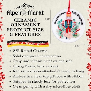 May include: A 2.8 inch round ceramic ornament featuring a nutcracker with a red and blue uniform, surrounded by greenery and flowers. The ornament has the text "Merry Christmas" and "Frohe Weihnachten" on it.