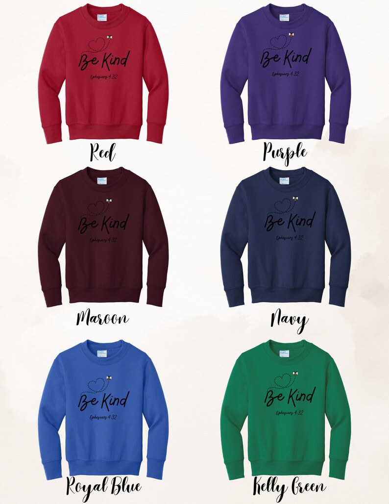 May include: A collection of six crewneck sweatshirts in various colors: red, purple, maroon, navy, royal blue, and kelly green. Each sweatshirt features the phrase "Be Kind" with a heart and bee design, along with the reference "Ephesians 4:32" in black script.