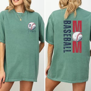 Custom baseball Mom Shirt. The baseball TShirt says baseball mom on the back in navy and red. The front is personalized with a baseball and the player name and number. Comfort colors tee, crewneck, short sleeves