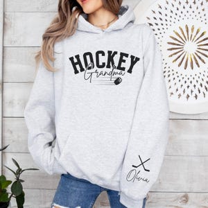 Hockey Grandma Hoodie Personalized Hockey Sweatshirt Name on Sleeve Hockey Grandma Sweater Custom Hockey Gift for Grandma Game Day Hockey