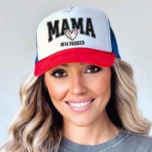 Custom baseball mom hat. the baseball hat says mama and has a baseball shaped heart in the center. the baseball mom trucker hat is personalized with the player name and number. adjustable, mesh back, baseball trucker hat