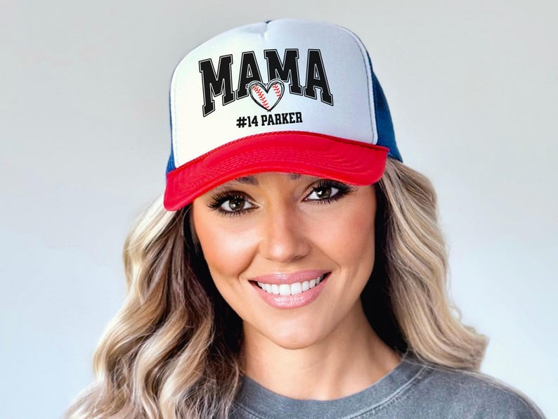 Custom baseball mom hat. the baseball hat says mama and has a baseball shaped heart in the center. the baseball mom trucker hat is personalized with the player name and number. adjustable, mesh back, baseball trucker hat