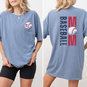 Custom baseball Mom Shirt. The baseball TShirt says baseball mom on the back in navy and red. The front is personalized with a baseball and the player name and number. Comfort colors tee, crewneck, short sleeves