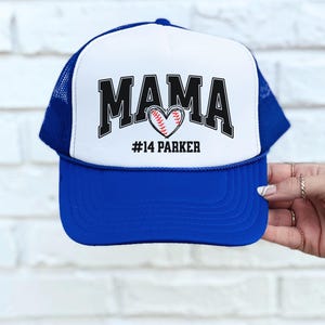 Custom baseball mom hat. the baseball hat says mama and has a baseball shaped heart in the center. the baseball mom trucker hat is personalized with the player name and number. adjustable, mesh back, baseball trucker hat