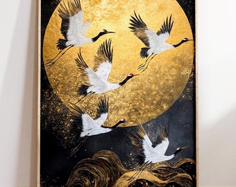 May include: A framed artwork featuring five cranes in flight against a golden moon and a dark, textured background. The cranes have white bodies, black wings, and red accents. The artwork is in a vertical orientation.