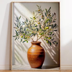 May include: Framed print of a brown ceramic vase filled with olive branches and green olives. The vase is centrally positioned, with the branches spreading upwards. The background is a neutral colour with shadows.