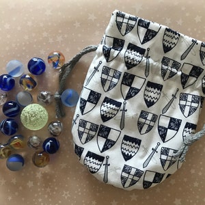 Marble bag with marbles swords and shields image 1