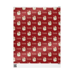 May include: Red wrapping paper with a repeating pattern of Santa Claus faces and the name "Tucker" written in white.