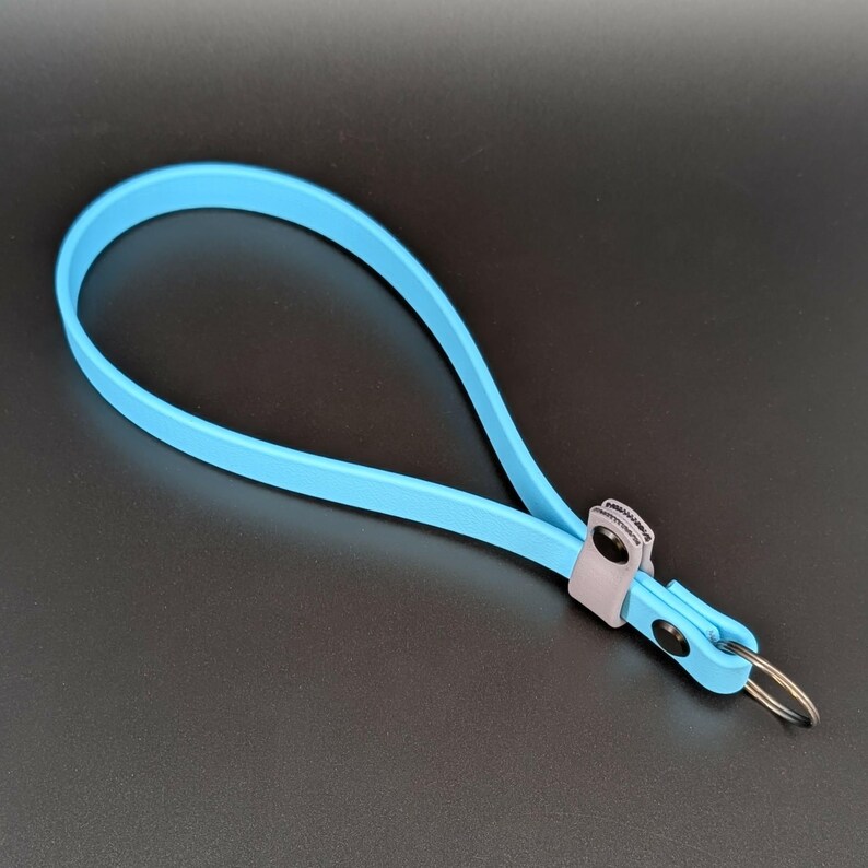 light blue and gray biothane adjustable wrist strap for e-collar remote transmitter for dog training