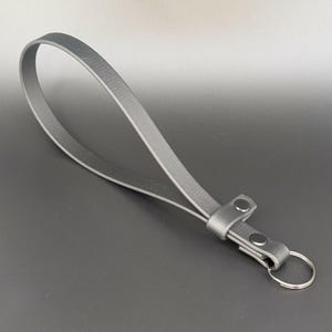 black biothane adjustable wrist strap for e-collar remote transmitter for dog training