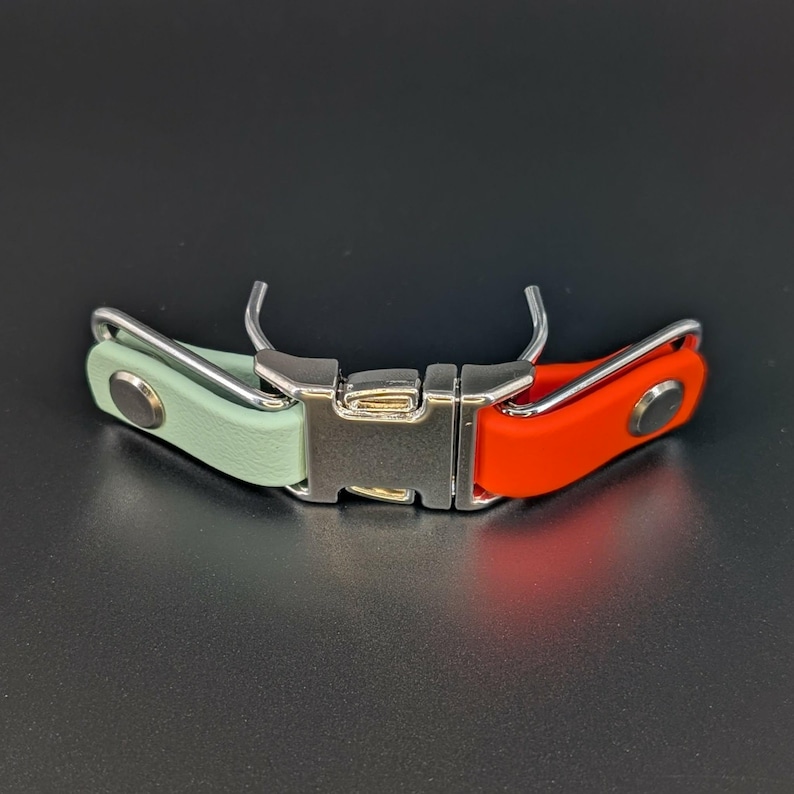 mint green and orange biothane with silver hardware quick release buckle attachment for prong collar