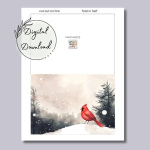 May include: A printable card featuring a red cardinal bird perched on a snowy hill with a wintery forest background. The card is designed to be cut out and folded in half.