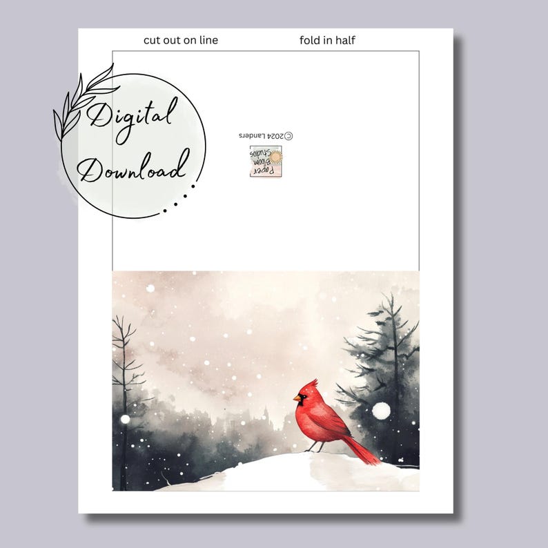 May include: A printable card featuring a red cardinal bird perched on a snowy hill with a wintery forest background. The card is designed to be cut out and folded in half.