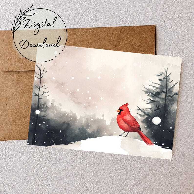 May include: A watercolor painting of a red cardinal bird perched on a snowy hill in a winter forest. The background is a soft, muted gray with white snow falling. The cardinal is facing left and has a black eye and beak.