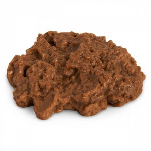 May include: A close-up of a brown chocolate spread, showing its smooth and creamy texture.