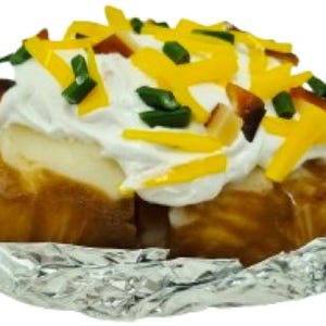 May include: A baked potato wrapped in foil, loaded with sour cream, shredded cheddar cheese, chives, and bacon bits. The potato has a golden-brown skin and is cut open to reveal the fluffy interior. A classic comfort food.