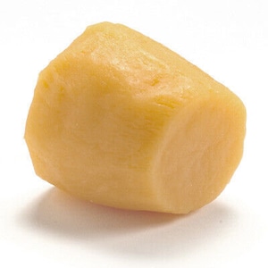 May include: A single, pale yellow, irregularly shaped piece of marzipan.