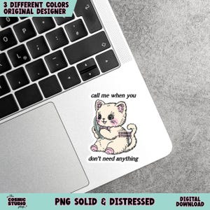 May include: A sticker featuring a cartoon kitten holding a phone, with the text "call me when you don't need anything." The sticker is on a laptop, with additional text at the top and bottom. The kitten is cream-colored with pink accents.