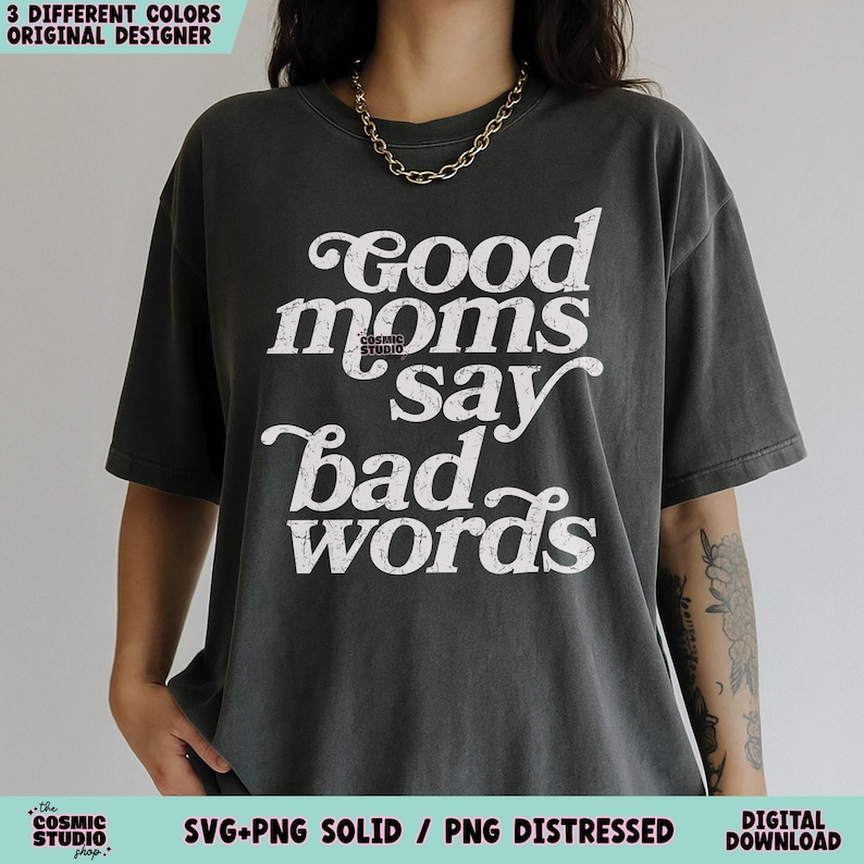 May include: Dark gray t-shirt with the text "Good moms say bad words" in white, stylized lettering. The shirt features a crew neck and short sleeves. The image also includes text that says "3 different colors original designer" and "SVG+PNG solid / PNG distressed digital download".