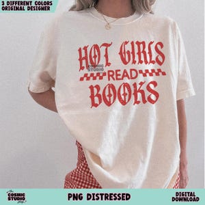 May include: A white t-shirt with a red graphic that says "HOT GIRLS READ BOOKS" in a distressed font.