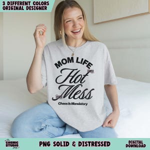 May include: A light gray t-shirt with the words "MOM LIFE Hot Mess" in black script. The phrase "Chaos Is Mandatory" is below. The shirt is part of a digital download and is available in three different colors.