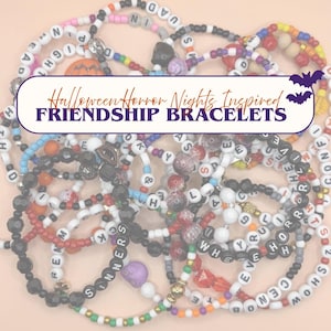 May include: A collection of colorful beaded friendship bracelets featuring letter beads with various words, including the text Halloween Horror Nights Inspired FRIENDSHIP BRACELETS. The bracelets are made of small round plastic beads in black, white, red, orange, and purple, with some featuring skull charms.