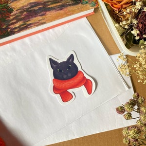 Gemütliche Katze im Schal-Aufkleber, entzückende Herbst-Dekor