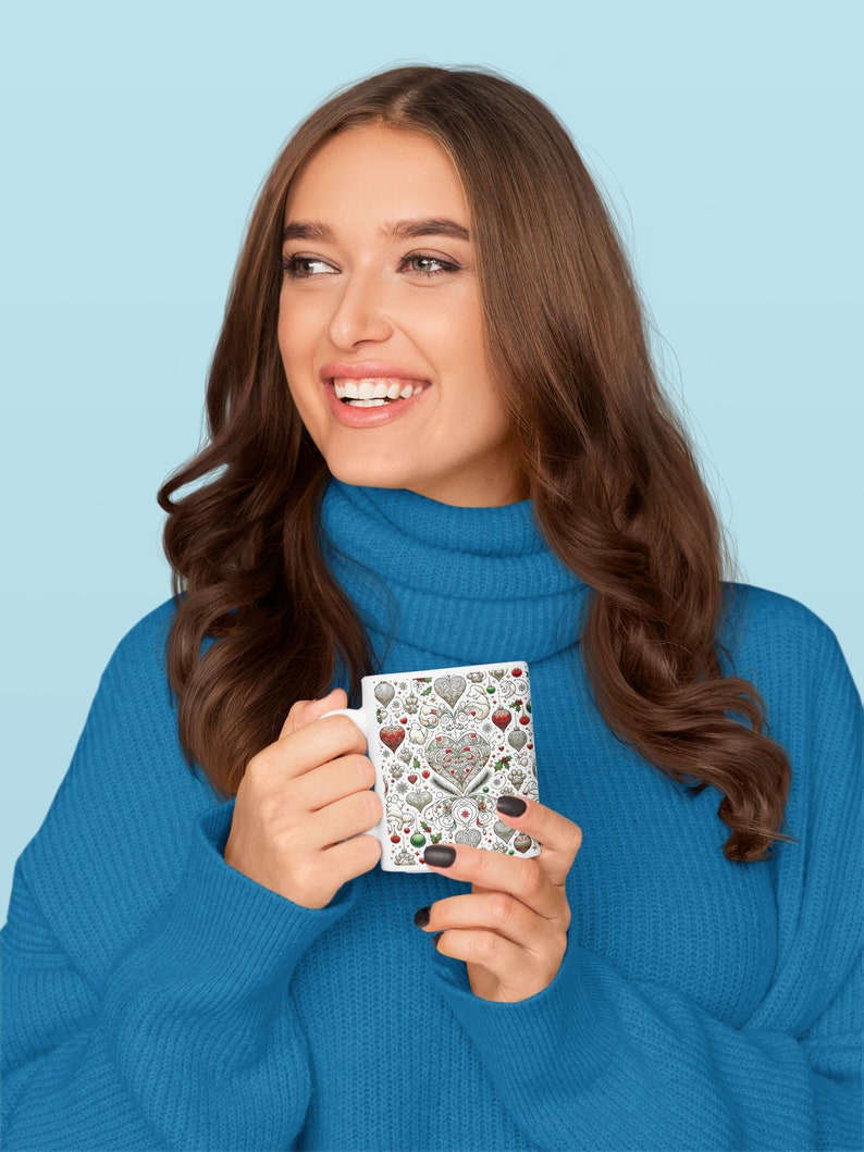 A woman wrapped in a blue sweater, smiling as she enjoys a beverage from the Pet Lover mug, the intricate pet-themed pattern wrapping the exterior.