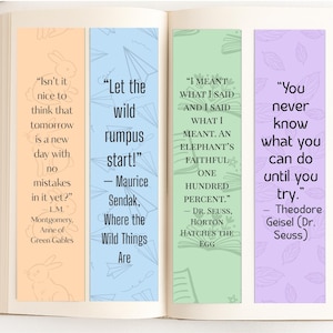 May include: An open book displaying four decorative bookmarks. Each bookmark has a quote from authors including L.M. Montgomery, Maurice Sendak, Dr. Seuss, and Theodore Geisel. The bookmarks are in orange, blue, green, and purple.