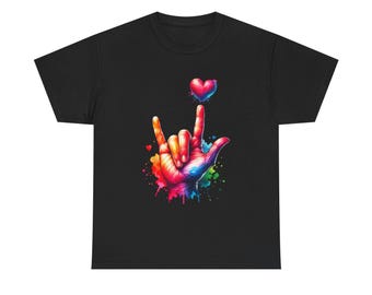 May include: Black t-shirt featuring a colorful hand gesture with the index and pinky fingers extended, forming the sign for "I love you." A watercolor heart floats above the hand. The design includes vibrant rainbow colors and paint splatter effects.