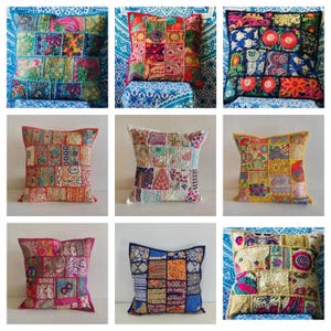 May include: A collection of nine decorative throw pillows with patchwork designs. The pillows feature a variety of colors, including blue, red, yellow, and pink. Each pillow has a unique pattern, with squares and rectangles of fabric sewn together.