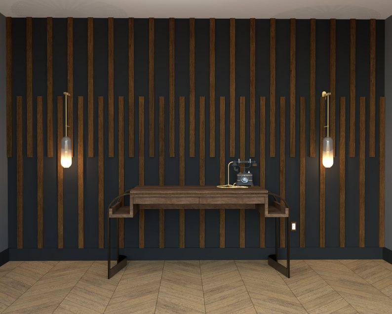 May include: A dark wood desk with a black metal frame sits in front of a wall with dark wood panels. Two gold wall sconces with glass shades are on either side of the desk.